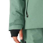 The 686 Woman's Hydra Insulated Jacket 2025 is shown in a sea foam green color with an insulated hood and a front zipper.