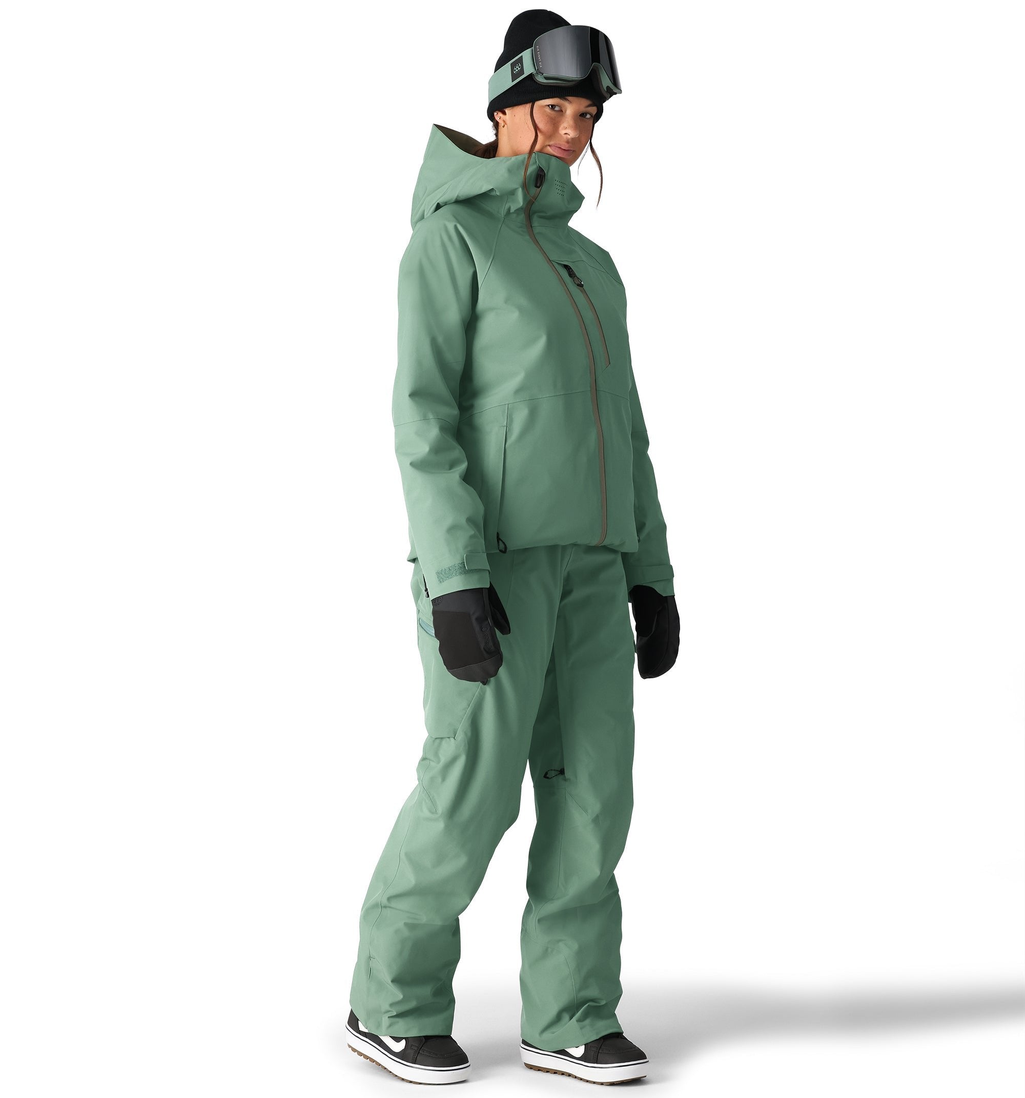 The 686 Woman's Hydra Insulated Jacket 2025 is primarily mint green with brown accents and a hood.