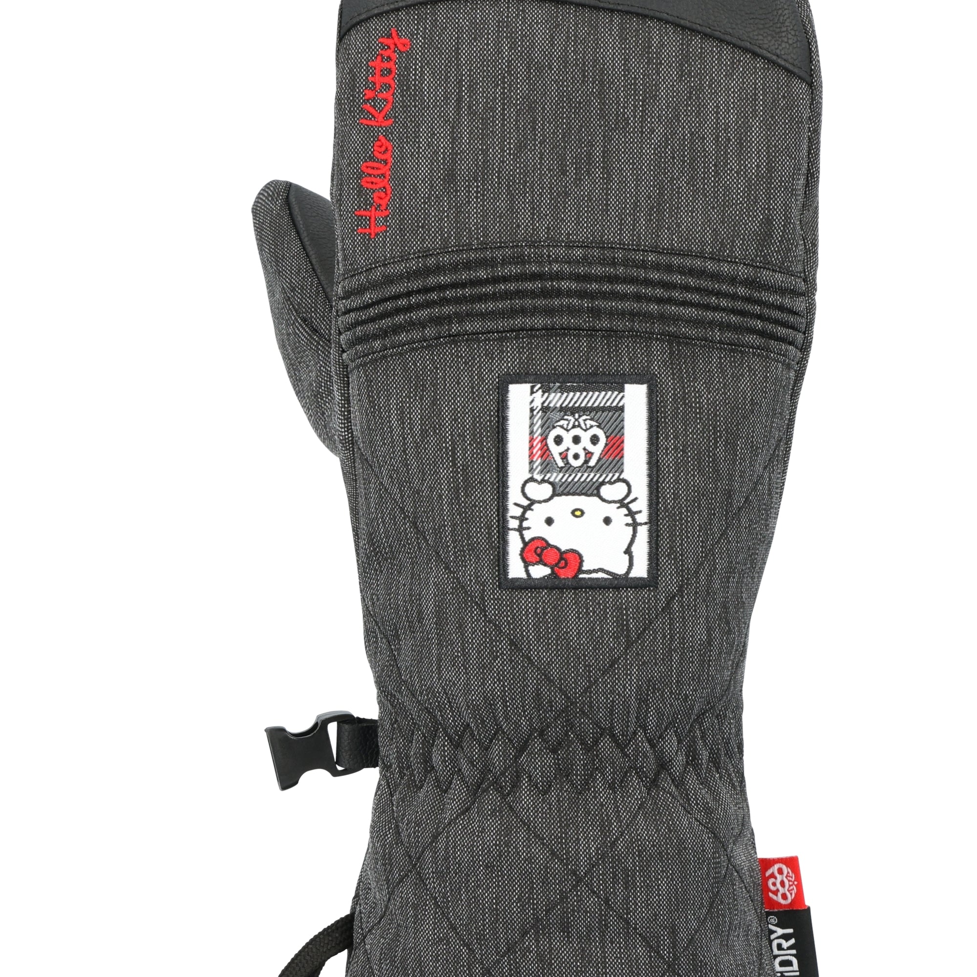 The 686 Women's Jubilee Mitt 2025 is shown from the front, featuring a quilted gray fabric with black accents and a red logo on the back.