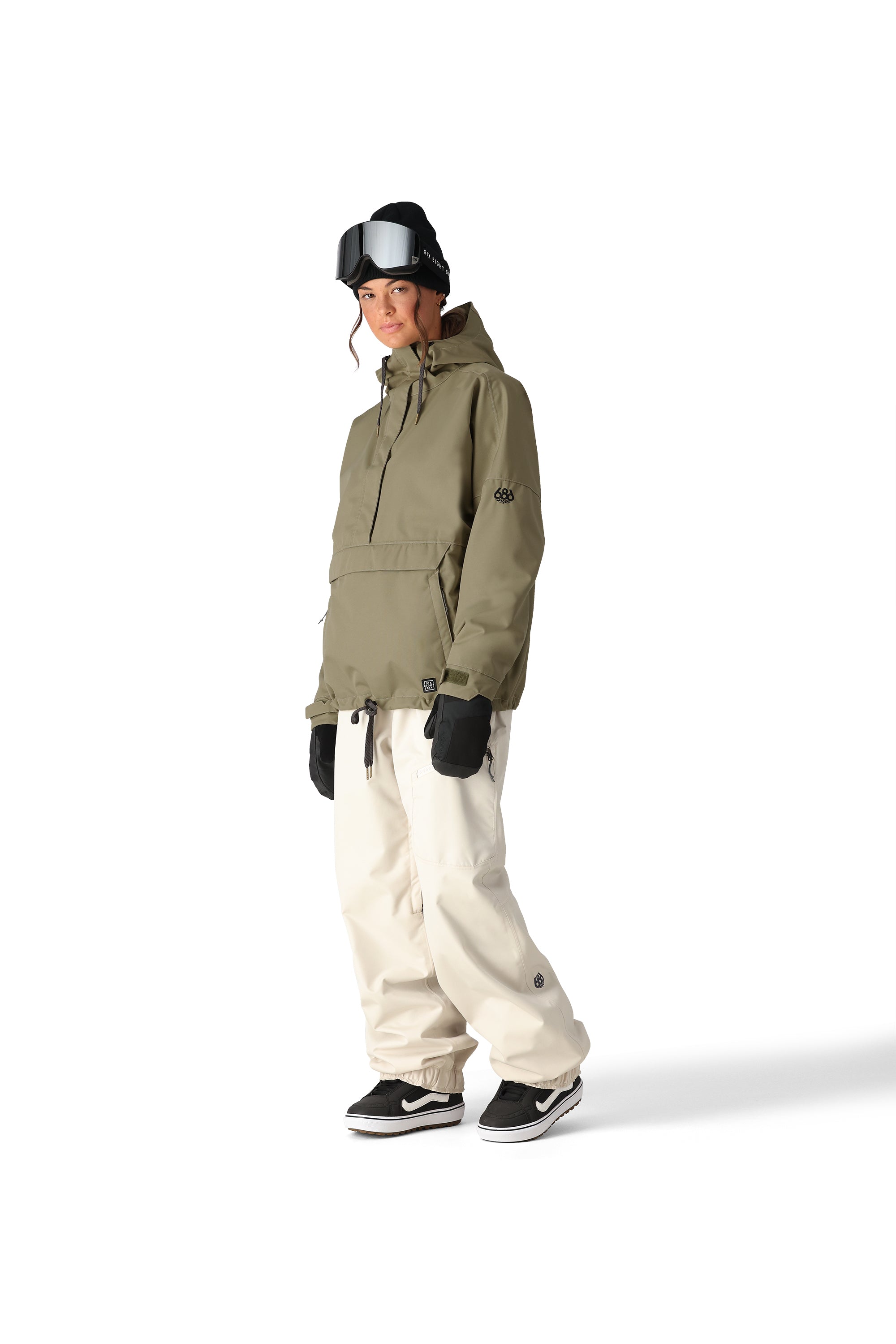 The 686 Women's Outline Shell Anorak 2025 appears to be khaki-colored with a hood and drawstring waist.