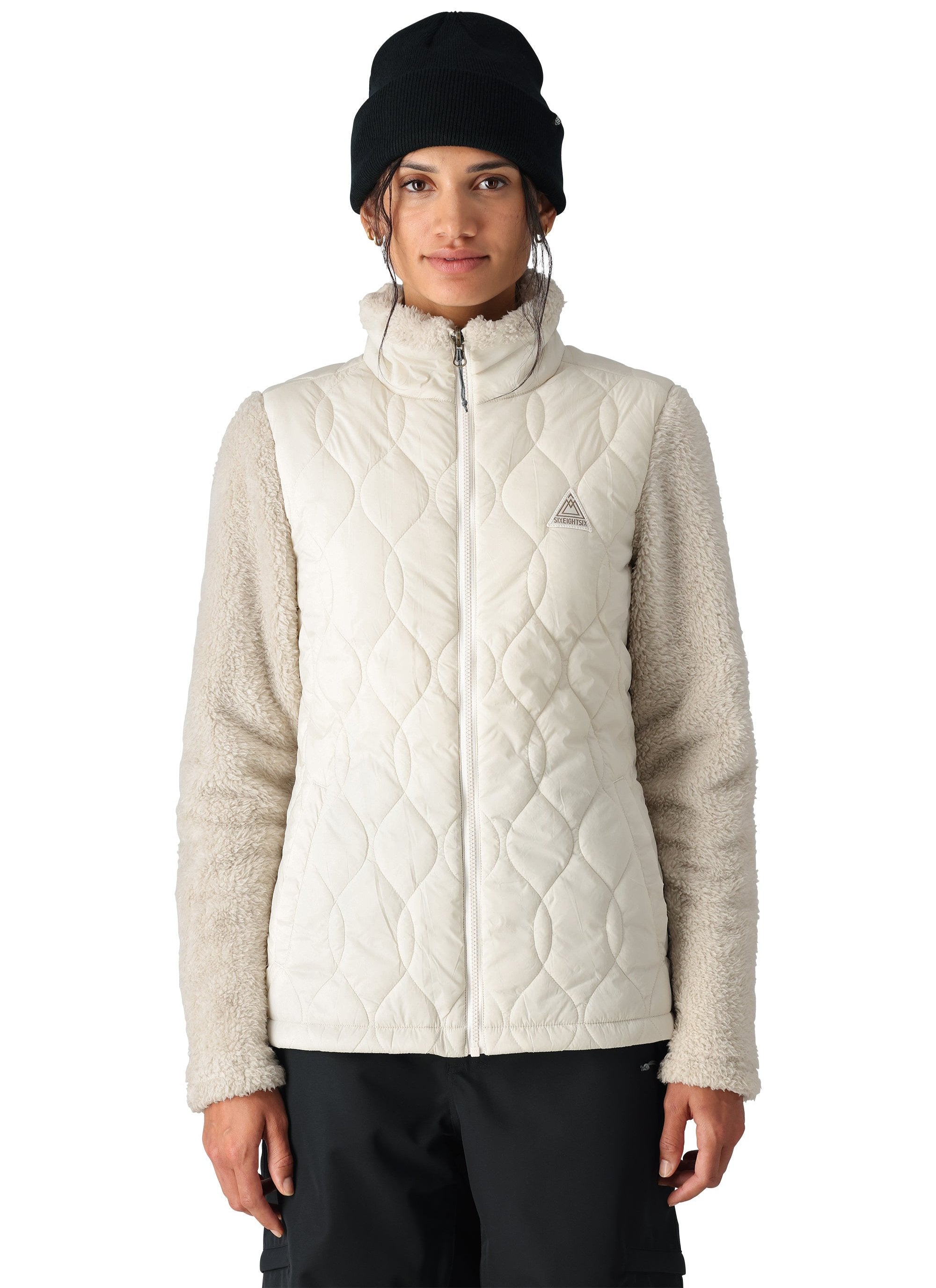 The 686 Smarty 3-in-1 Spellbound Jacket in white has an insulated hood and a quilted front.