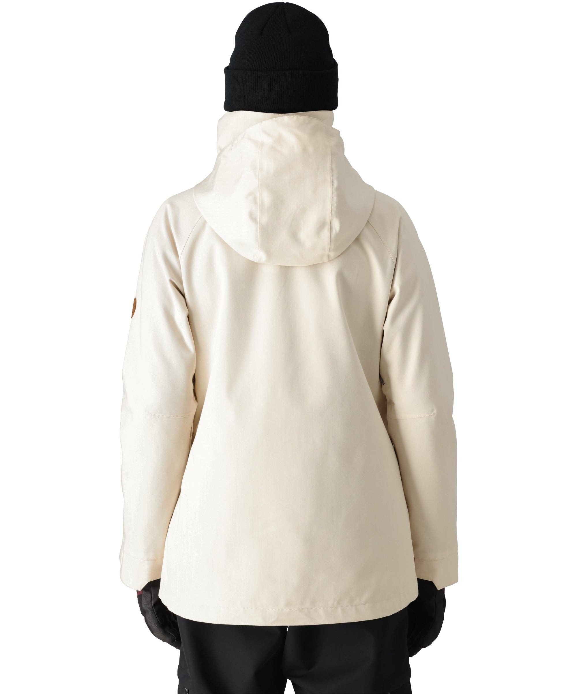 The 686 Women's SMARTY 3-in-1 Spellbound Jacket features a cream-colored front view with a high collar and zippered pockets.