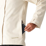 The 686 Women's SMARTY 3-in-1 Spellbound Jacket in cream features a front zip closure and two zippered pockets on the side.