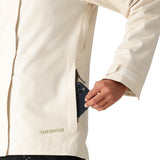 The 686 Women's SMARTY 3-in-1 Spellbound Jacket in cream features a front zip closure and two zippered pockets on the side.