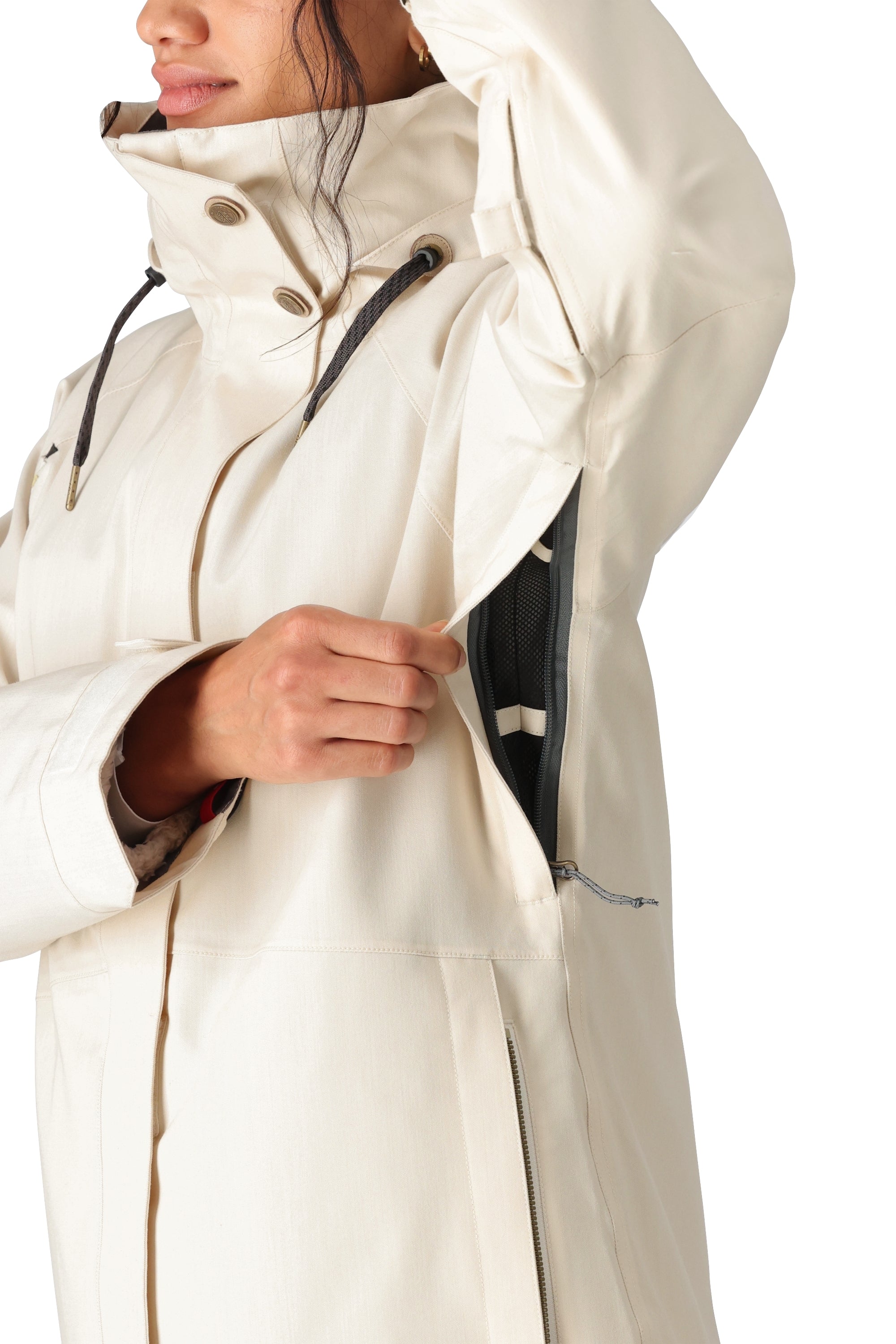 The 686 Women's SMARTY 3-in-1 Spellbound Jacket has a white color with an insulated hood and zippered pockets.