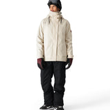 The 686 Women's SMARTY 3-in-1 Spellbound Jacket in cream features a high collar and zippered pockets.