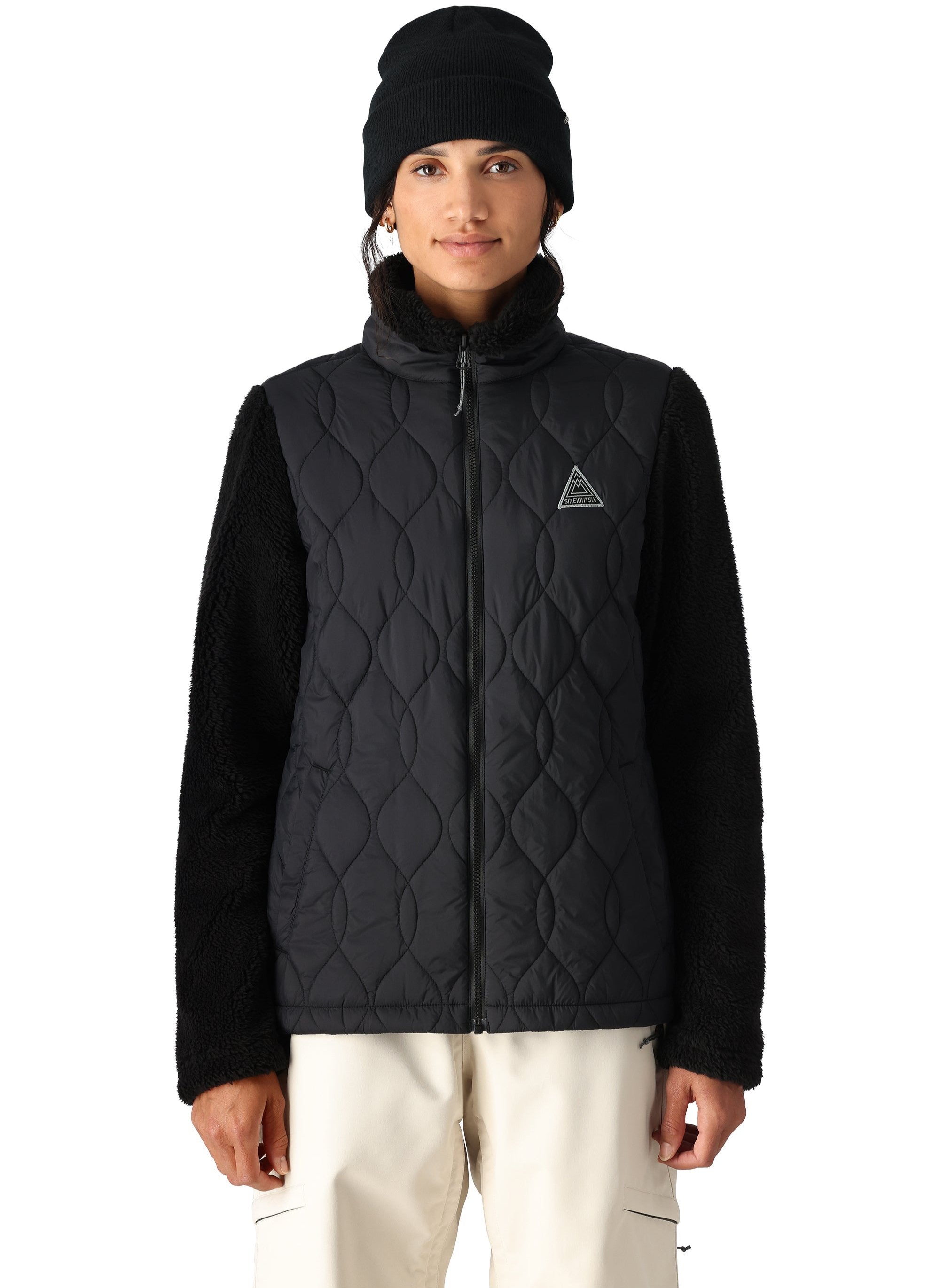 The 686 Women's SMARTY 3-in-1 Spellbound Jacket features a black quilted front with a black BOA dial on the left chest.