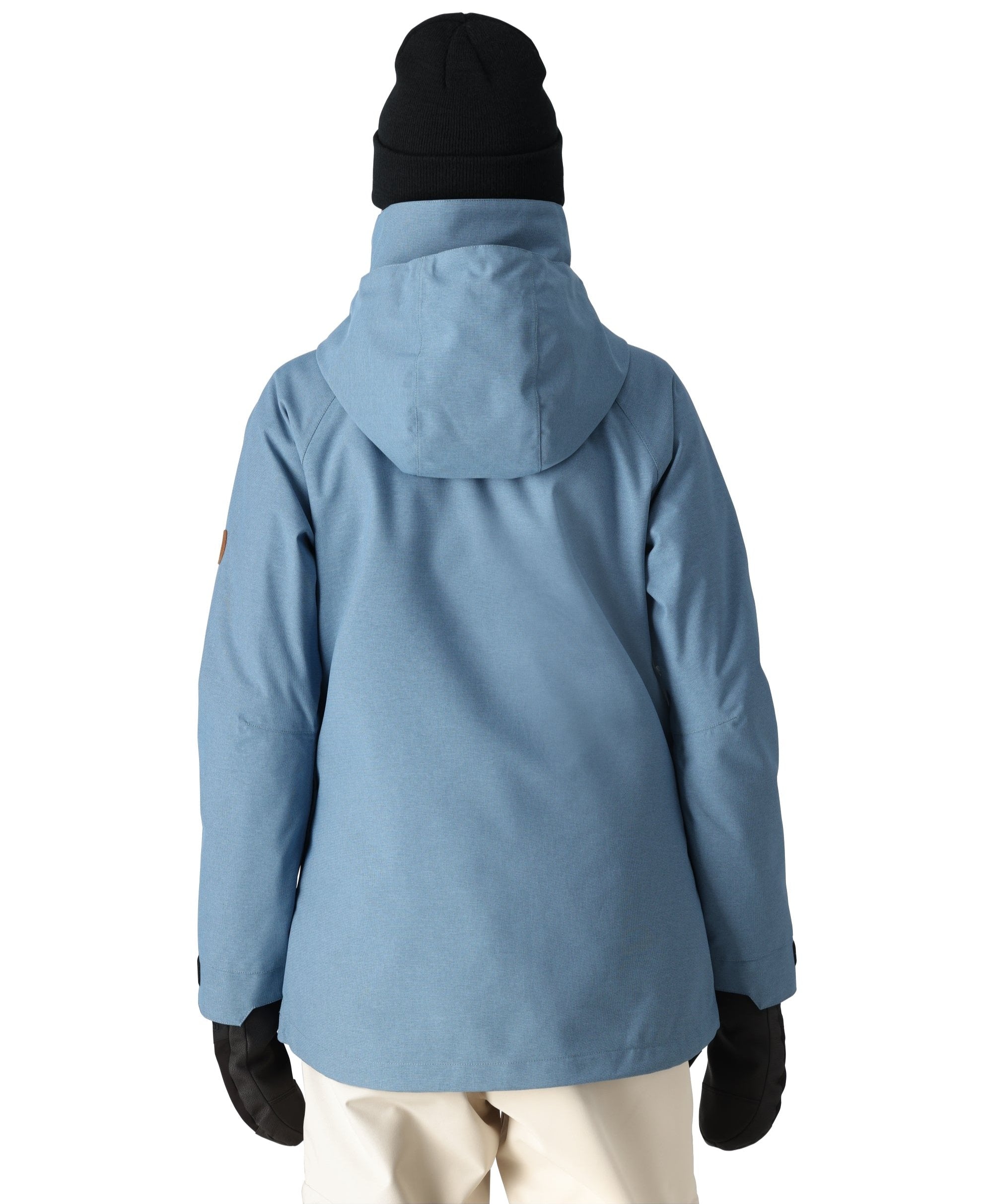The 686 Women's SMARTY 3-in-1 Spellbound Jacket in light blue has a hood and appears to be fully zipped up.