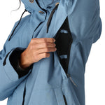 The 686 Women's SMARTY 3-in-1 Spellbound Jacket in blue has an insulated hood and zipper closure.
