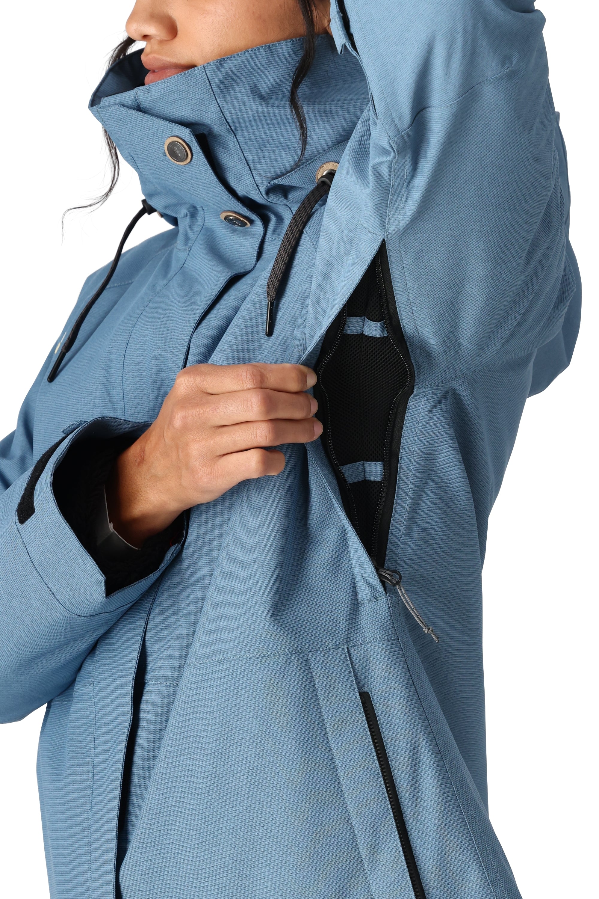 The 686 Women's SMARTY 3-in-1 Spellbound Jacket in blue has an insulated hood and zipper closure.