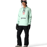 The 686 Women's Waterproof Hoody 2025 is mint green with a black zipper and drawstring at the hood.