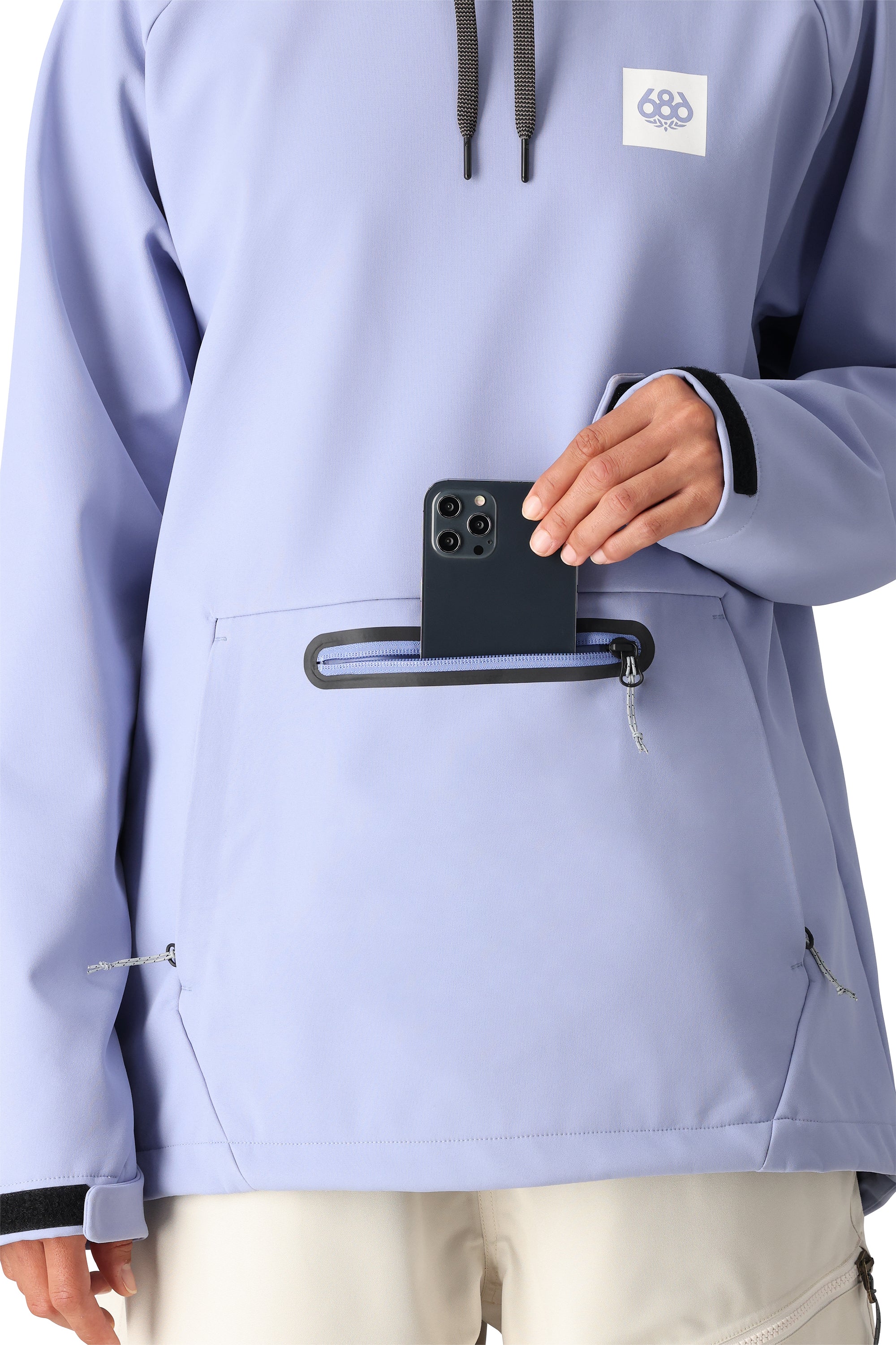 The 686 Women's Waterproof Hoody 2025 is light purple with a white logo in the upper right corner and a black BOA dial on the back.