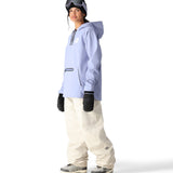 The 686 Women's Waterproof Hoody 2025 is periwinkle blue with black accents and a zippered pocket on the front.