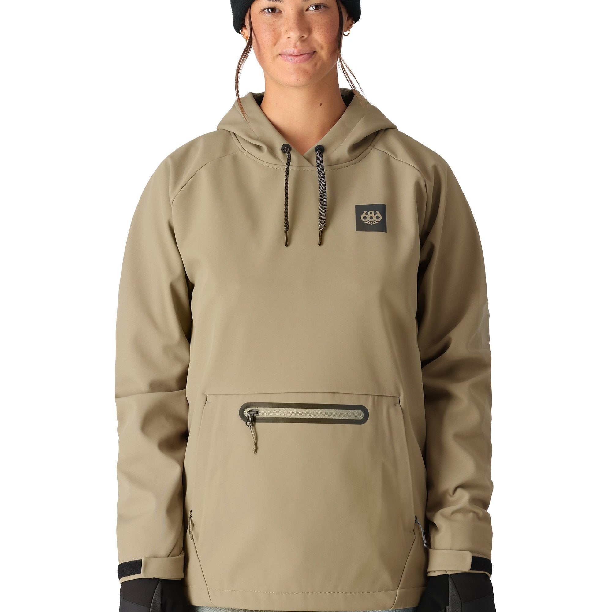 The 686 Women's Waterproof Hoody 2025 has a khaki-colored front view with a black logo on the chest and a drawstring hood.