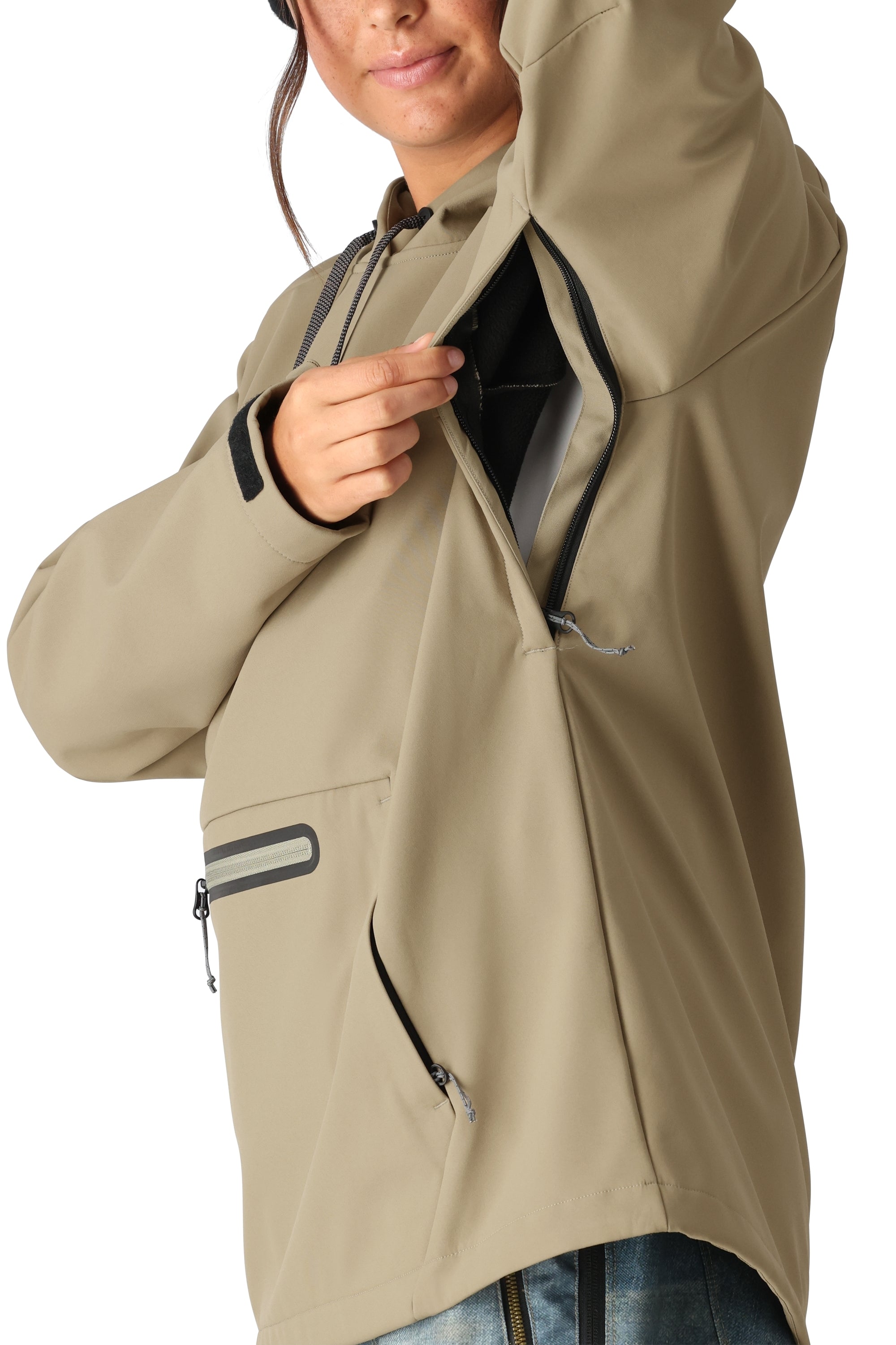 The 686 Womens Waterproof Hoody 2025 appears to be primarily tan with black accents on the zipper and cuffs.