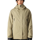 The 686 Whisper Insulated Jacket in tan has a high collar and zippered pockets.