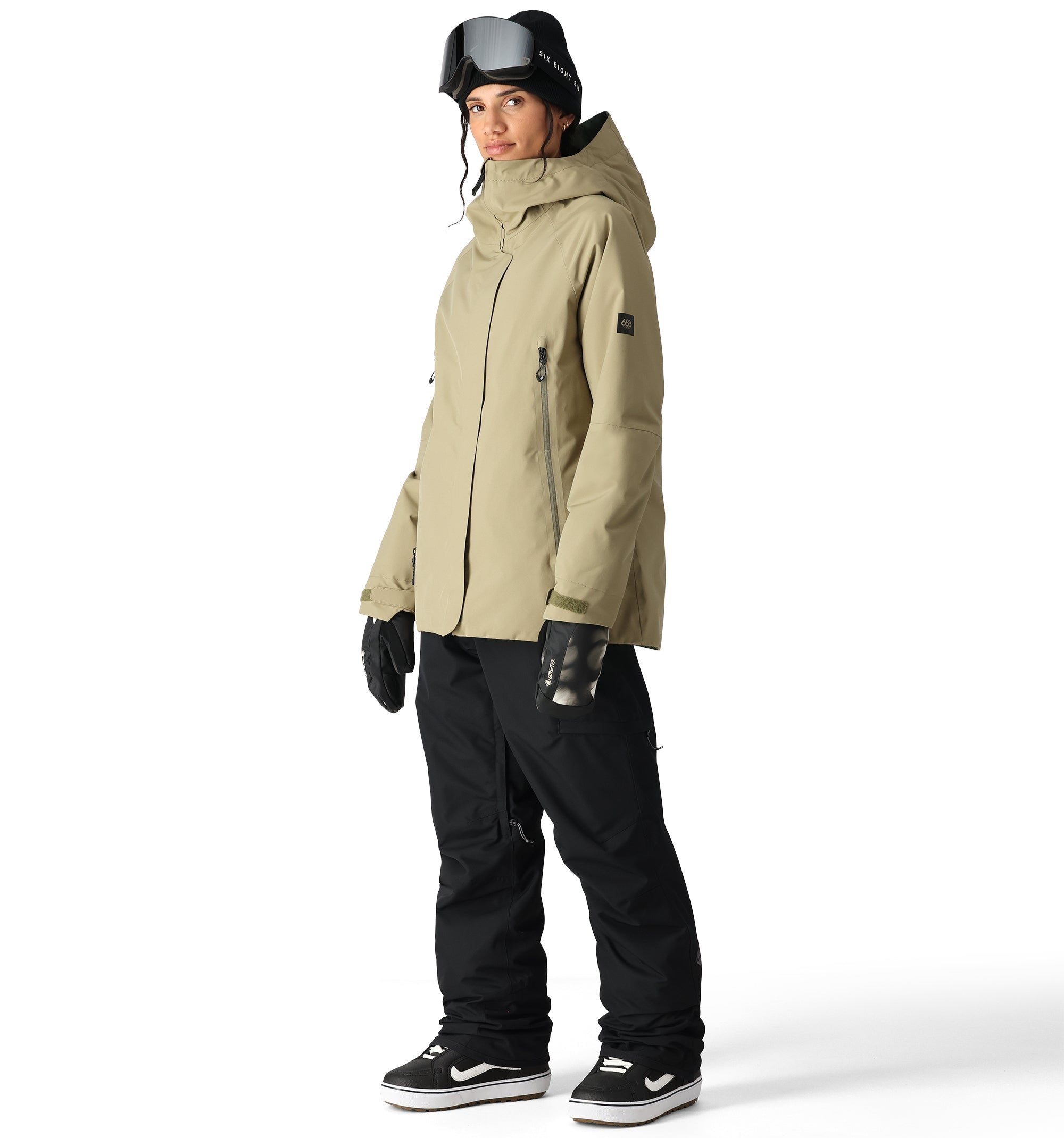 The 686 Women's Whisper Insulated Jacket in khaki has an insulated hood and zippered pockets.