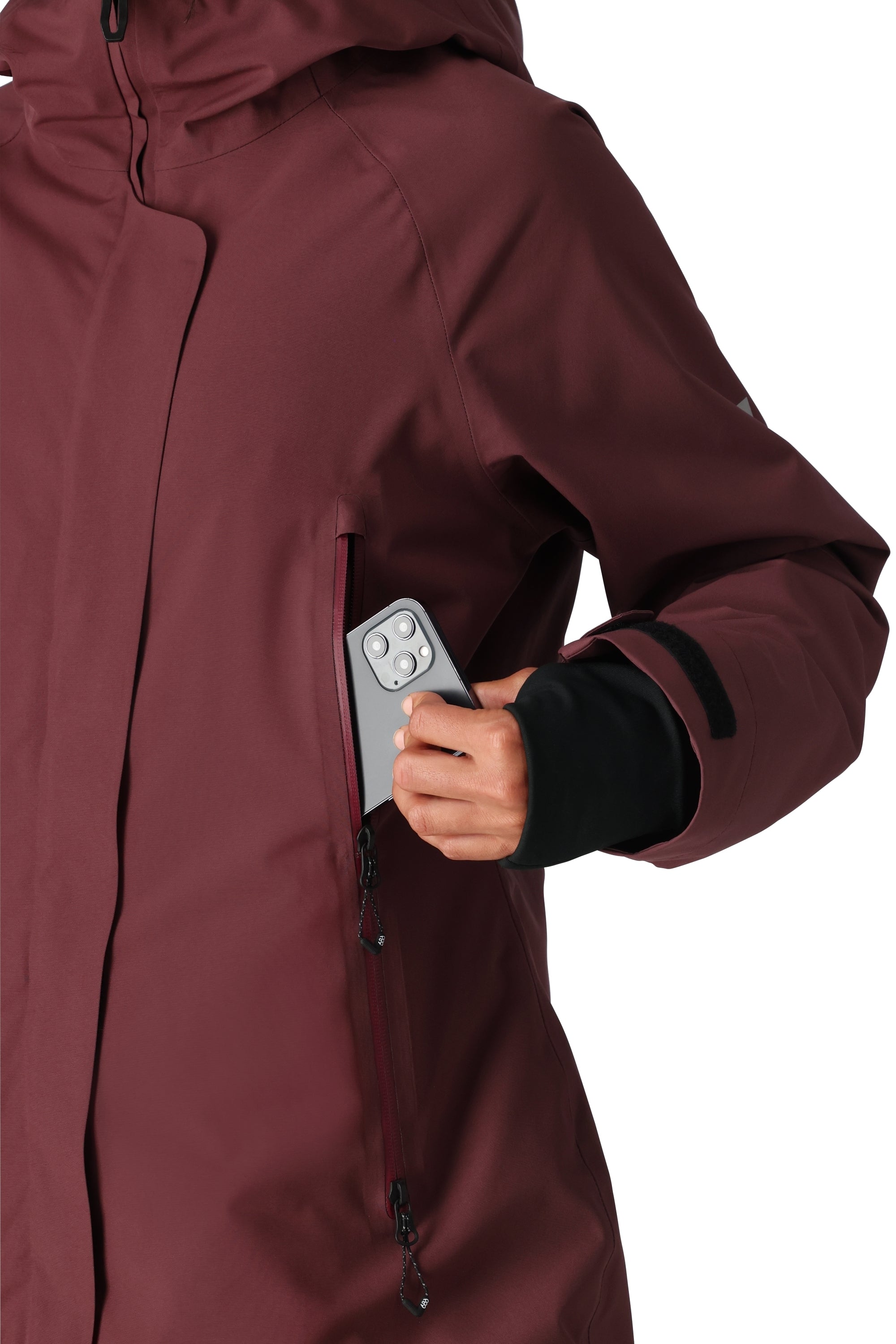 The 686 Whisper Insulated Jacket in burgundy has an insulated hood and zippered pockets.