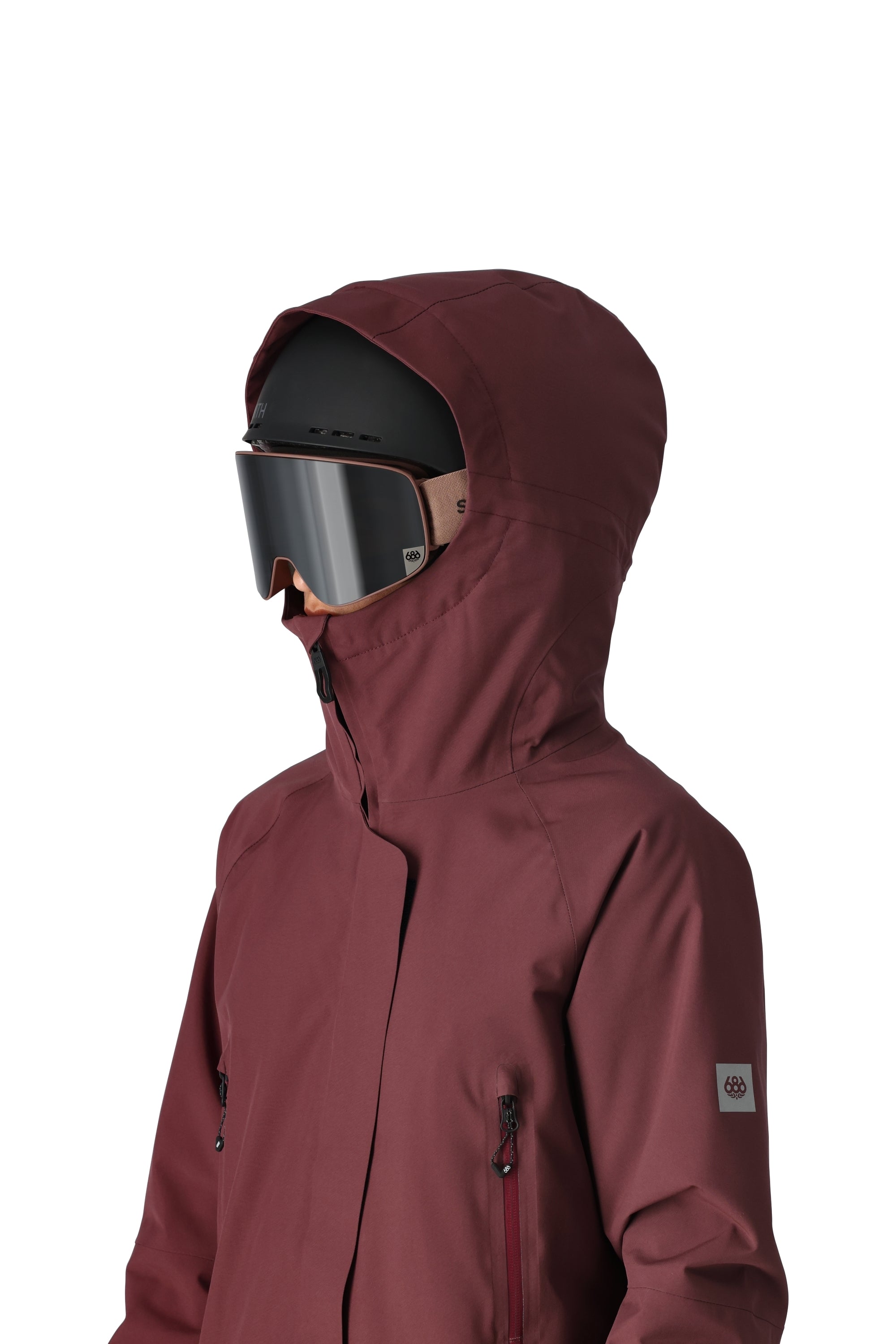 The 686 Women's Whisper Insulated Jacket 2025 is plum in color with an insulated hood and front zippered pockets.