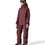 The 686 Whisper Insulated Jacket in mauve has a high collar and zippered pockets on either side.