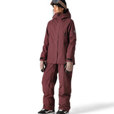 The 686 Whisper Insulated Jacket in mauve has a high collar and zippered pockets on either side.