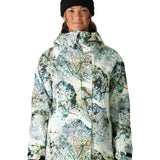 The 686 Women's Whisper Insulated Jacket 2025 has a white base with a multicolored abstract leaf pattern and a black zipper.