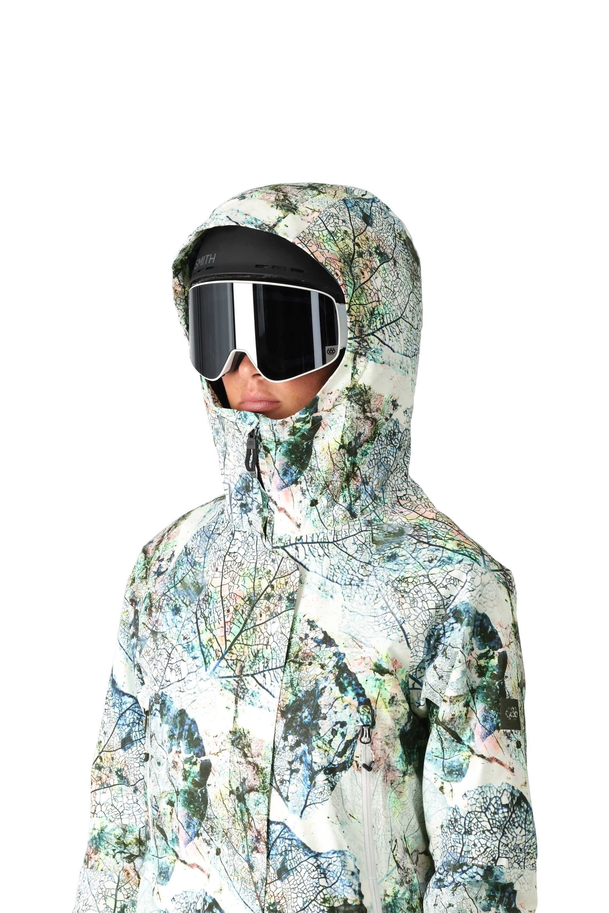 The 686 Whisper Insulated Jacket in white has a leaf print design with an insulated hood.