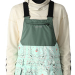 The 686 Harper bib shell features a solid black front with a subtle patterned back and side panels.