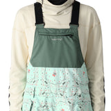 The 686 Harper bib shell features a solid black front with a subtle patterned back and side panels.