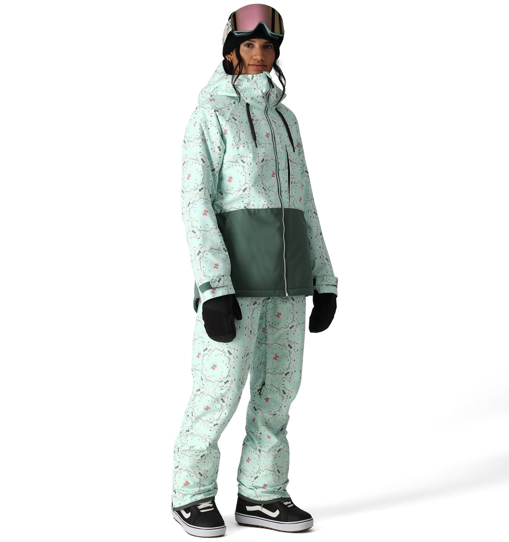 The 686 Harper shell bib, visible in front view, is mint green with a pattern of small red and black shapes.