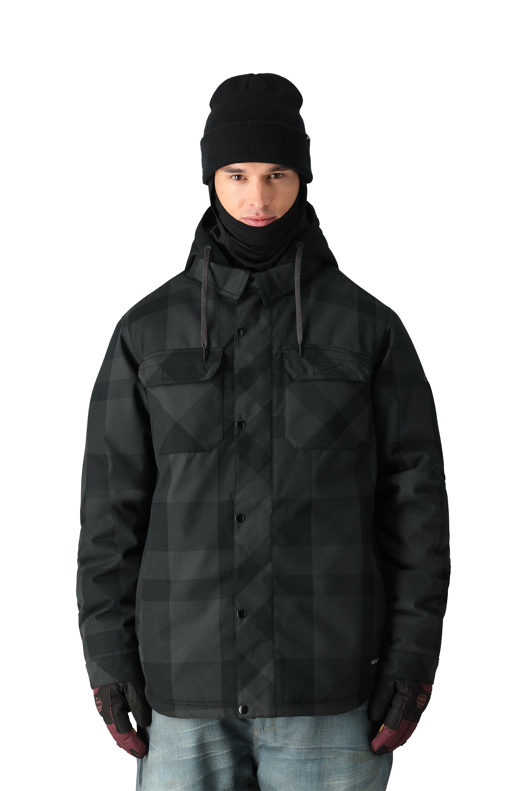 The 686 Woodland Insulated Jacket 2025 is black with a plaid pattern and has a hood.