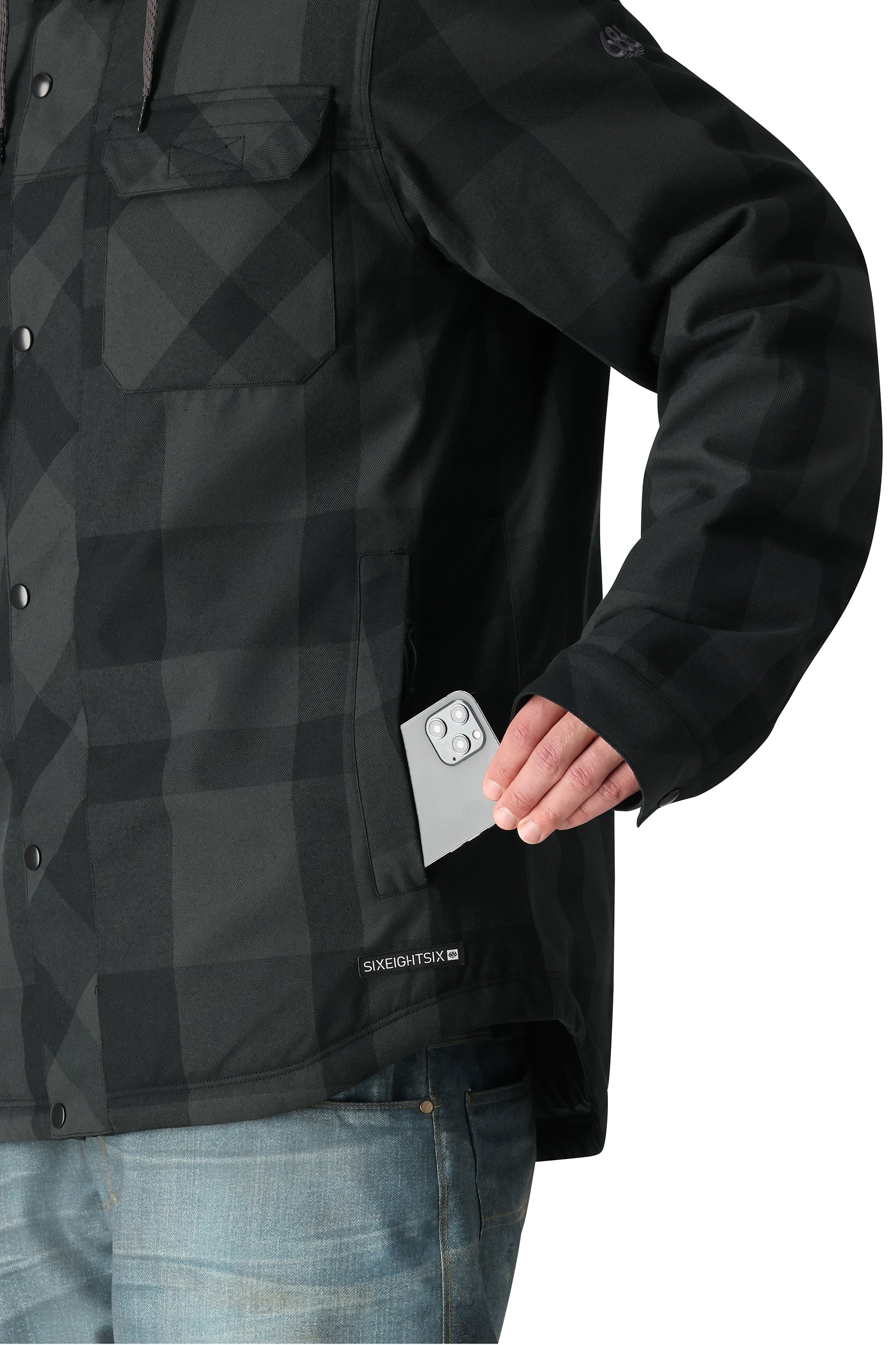 The 686 Woodland Insulated Jacket features a black plaid pattern with a quilted design and an insulated hood.