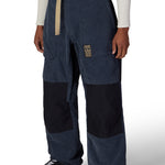 Men's 2.5L shell pant in navy with corduroy texture, black panels, logo