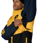Men's insulated jacket close-up, yellow and navy colorblock with zipper and logo patch