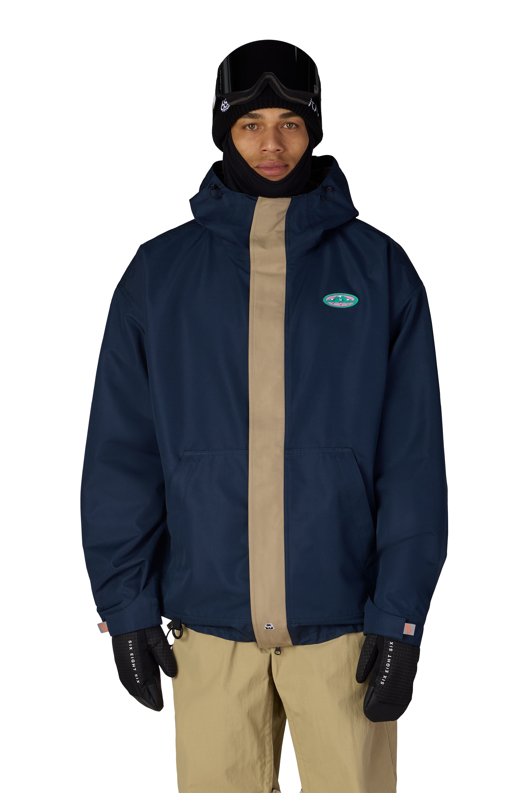 Men's navy hooded ski jacket with tan paneling and chest logo