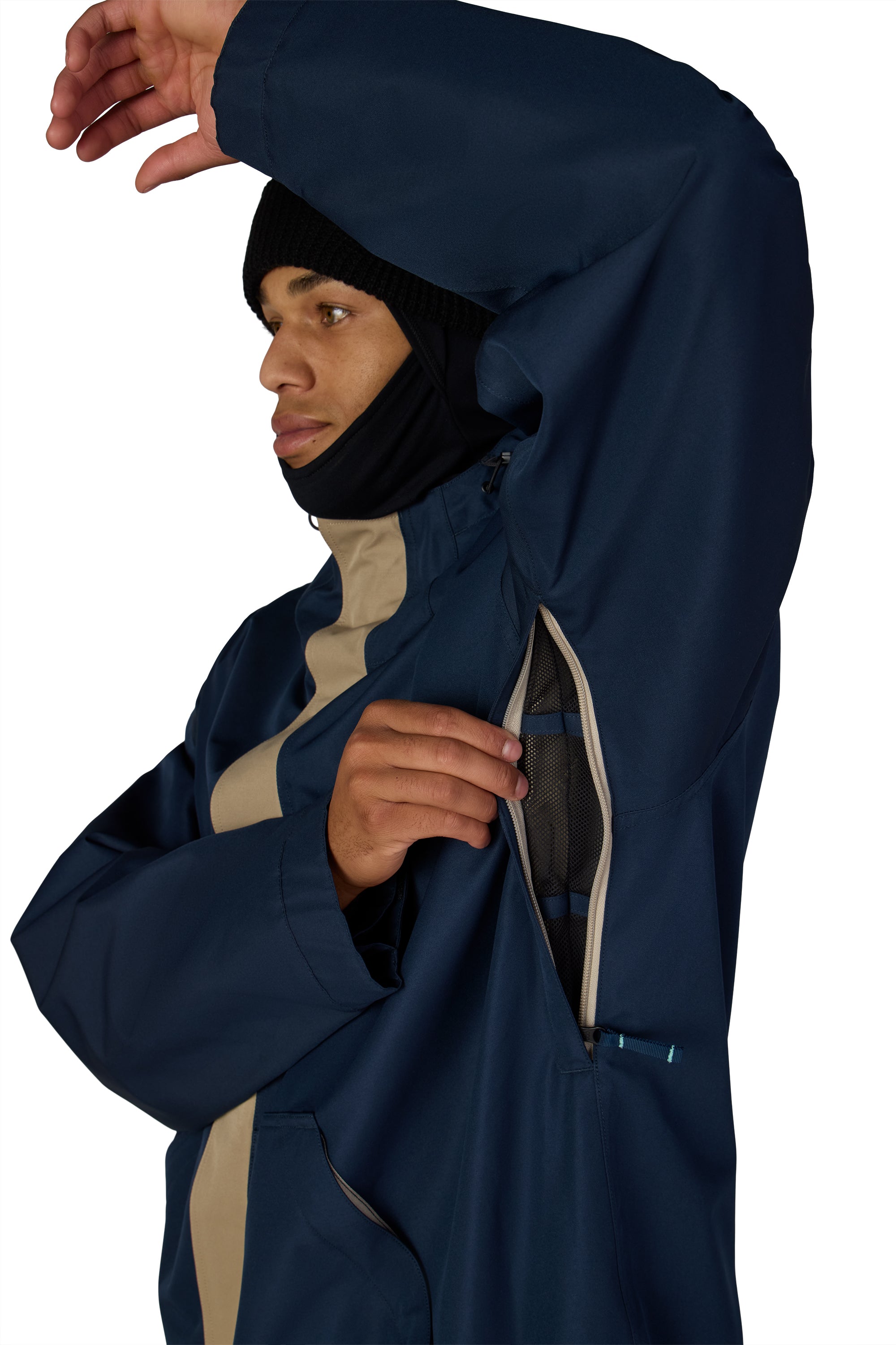 Men's navy ski jacket hood and front zipper opening with tan interior