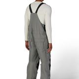 Gray insulated bib overalls with black shoulder straps and front storage pocket