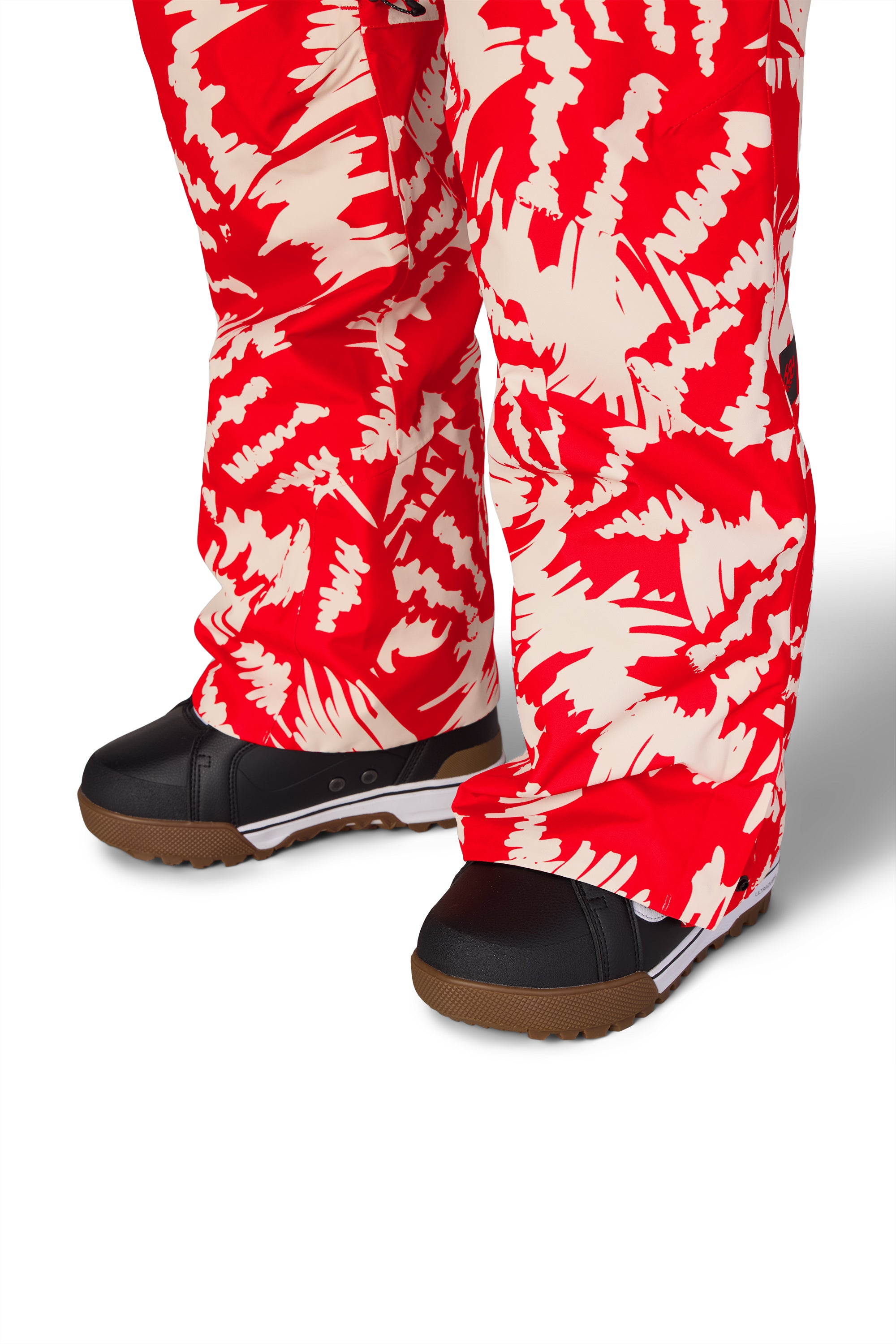 Women’s red-and-white patterned Thermagraph ski pants with straight legs and lace-up boots
