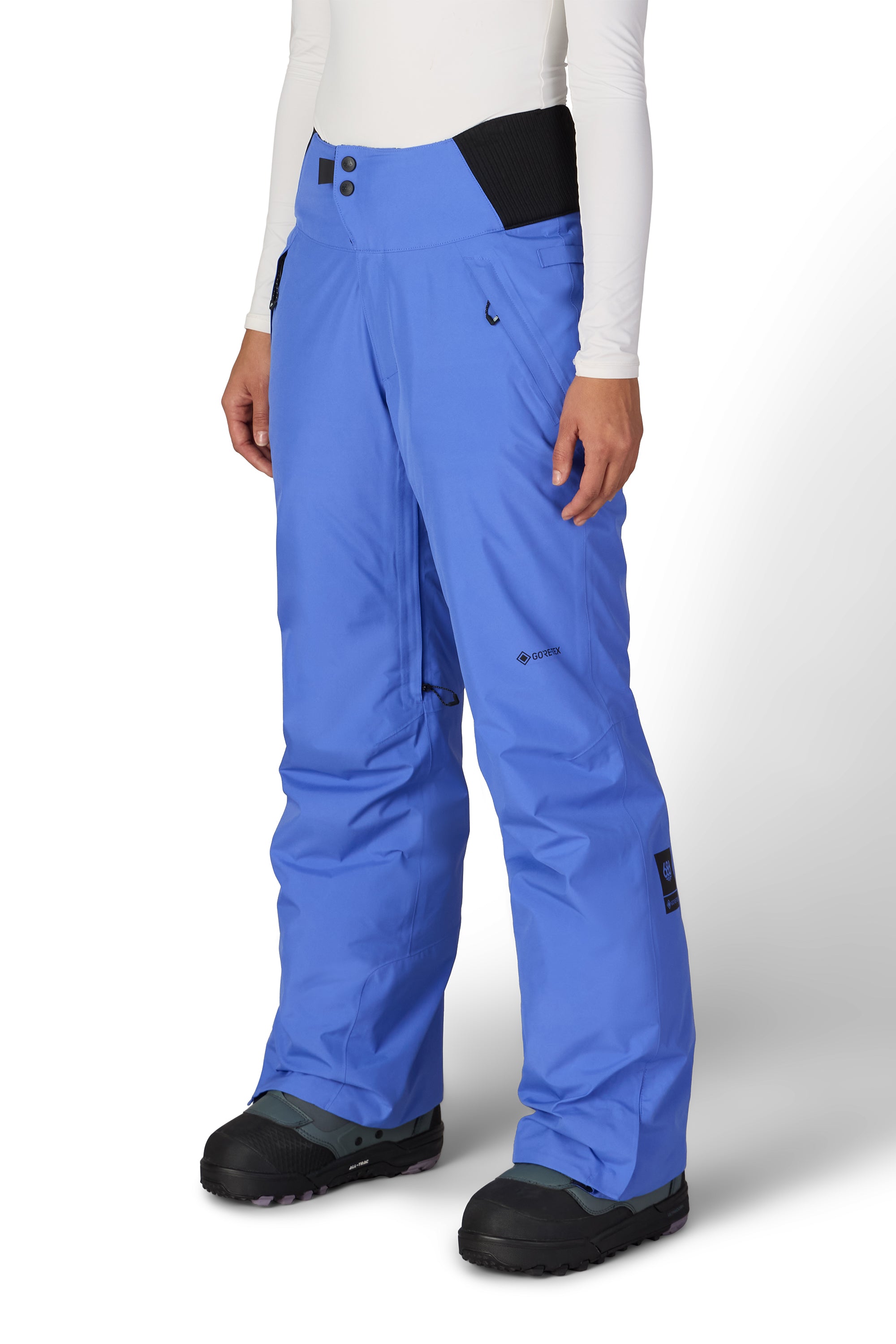 Blue insulated ski pants with zip thigh pocket and inner snow-cuff panel