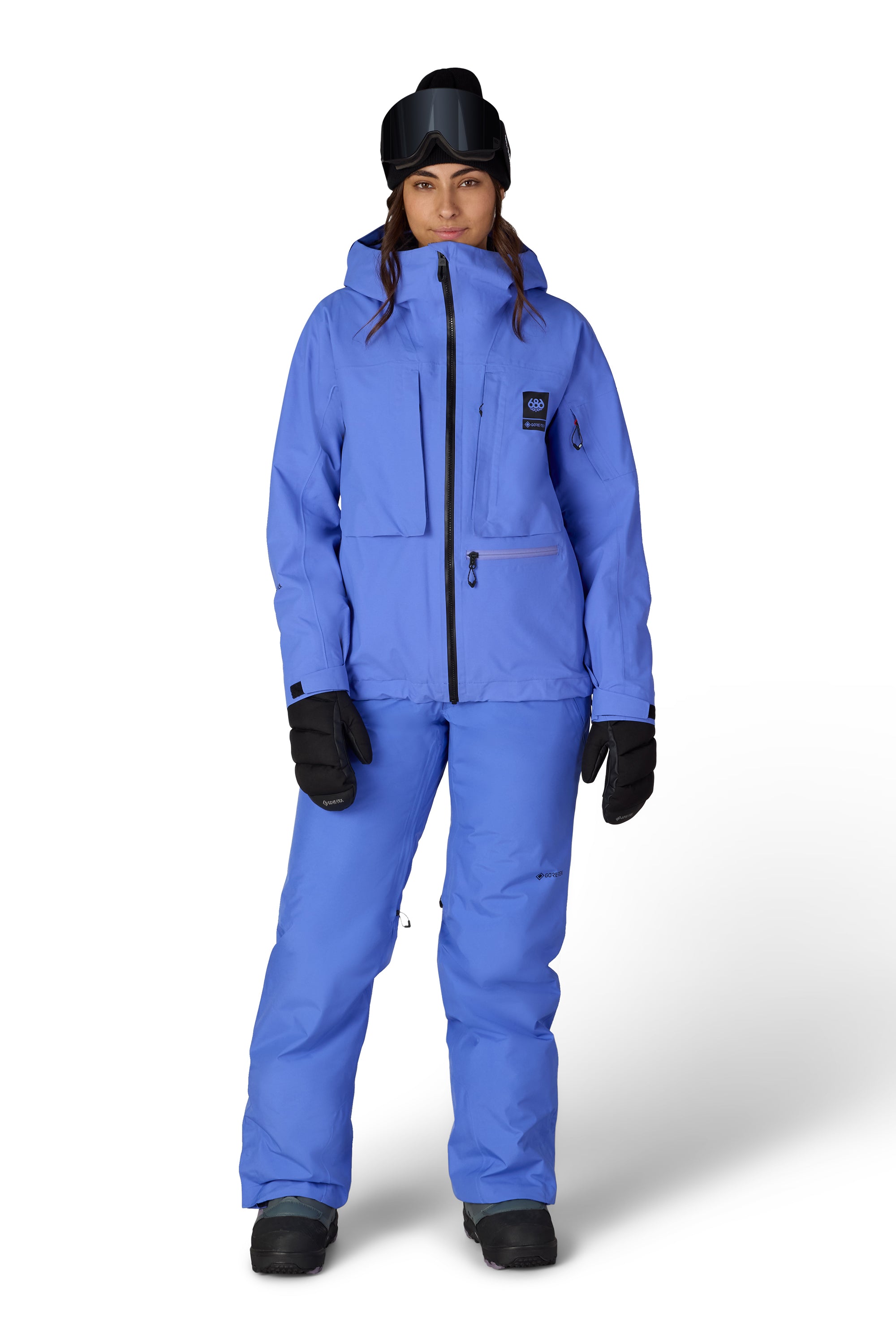 Blue insulated ski suit pants with front fly, zip pockets, and elastic cuffs