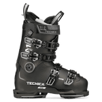 Black ski boot with four metal buckles and molded shell, side view
