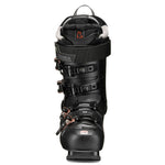 Tecnica Women's Mach 1 LV 95 Ski Boot 2026 - A black ski boot with copper-colored buckles and a black strap with a gray label featuring the word "TECNICA" in white letters.