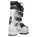 Tecnica Women's Mach BOA MV 95 Boot 2026 - A white ski boot with a black and white upper section, featuring a black strap with a white logo and a black buckle with a white "BOA" logo. The boot has a white sole with a black toe cap and a white heel counter. The Tecnica logo is visible on the side of the boot in gold letters. The boot is set against a light gray background.