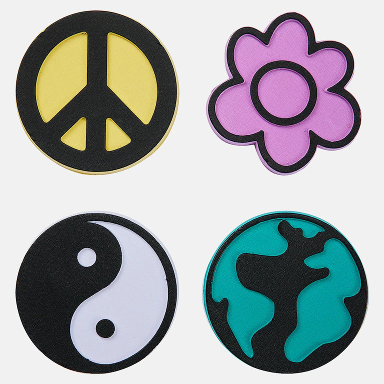 Burton Foam Stomp Pad 2025 - A round, yellow foam pad with a peace sign in the center.