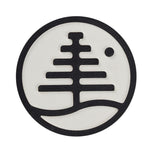 Burton Foam Mat Stomp Pad 2024 - A round, white foam mat with a black logo in the center and a small hole at the top-right corner.