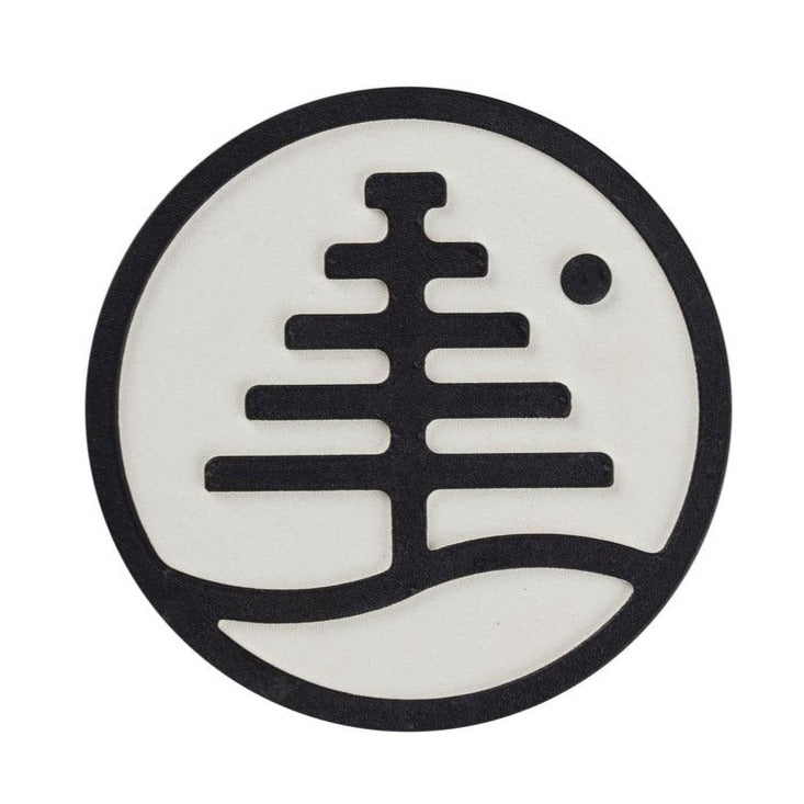 Burton Foam Mat Stomp Pad 2024 - A round, white foam mat with a black logo in the center and a small hole at the top-right corner.