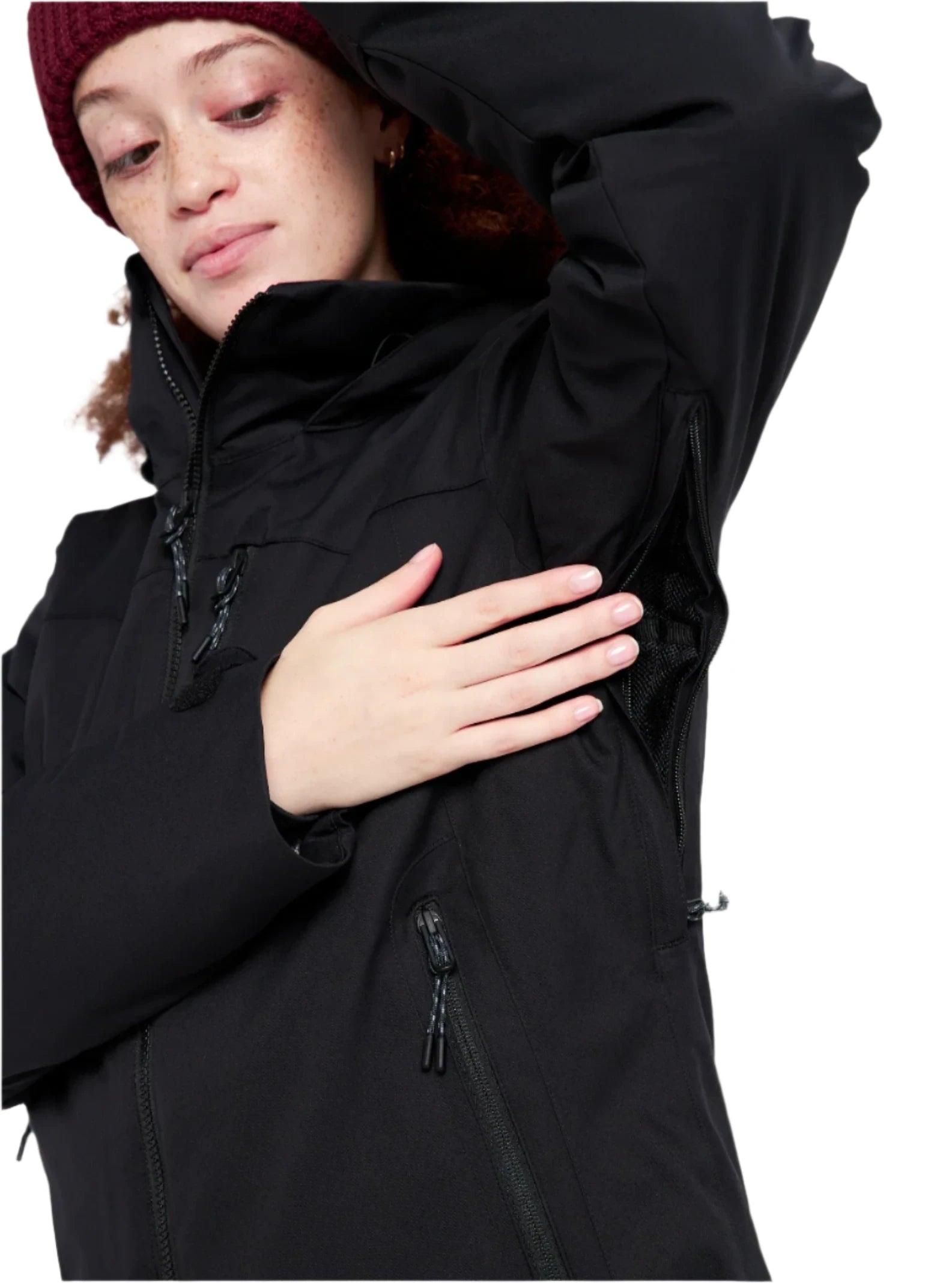 Burton Women's Lelah 2L Jacket - A black jacket with a high collar and zippered pockets, featuring a woman wearing it in the background.
