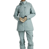 Burton Women's Lelah 2L Jacket 2025 - A light blue jacket with a hood, zippered pockets and a black zipper.