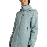 Burton Women's Lelah 2L Jacket 2025 - A light blue jacket with a high collar and zippered pockets, featuring a small black logo on the left sleeve.
