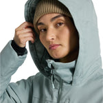 Burton Women's Lelah 2L Jacket 2025 - A light blue jacket with a hood, featuring a zipper and two zippered pockets on the front.